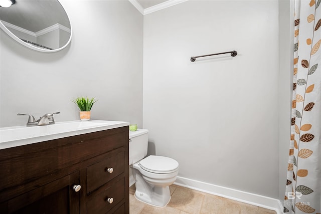 bathroom with ornamental molding, vanity, toilet, and tile patterned floors