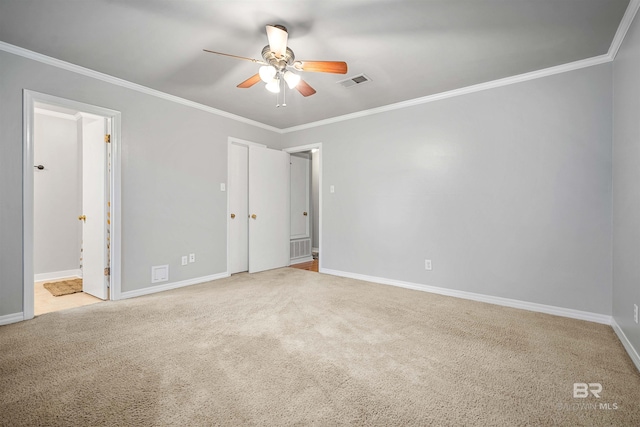 unfurnished bedroom featuring ornamental molding, ceiling fan, ensuite bathroom, and light carpet