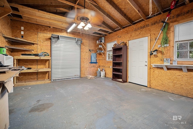 garage featuring a workshop area and ceiling fan