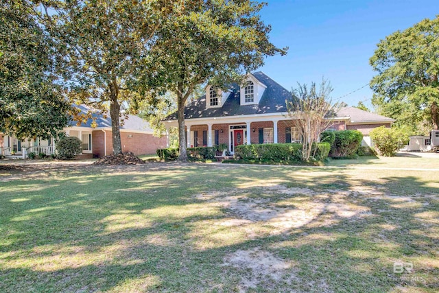 cape cod-style house with a front lawn and a porch