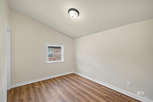 1096 S Pine St, Loxley, AL 36551 - empty room featuring wood finished floors and vaulted ceiling