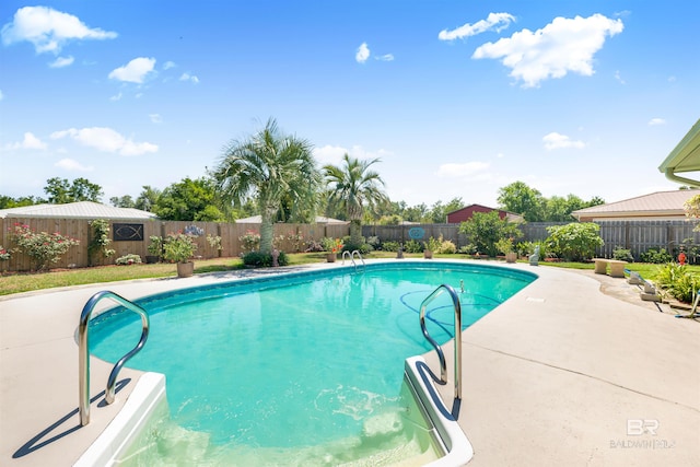 view of swimming pool with a patio area