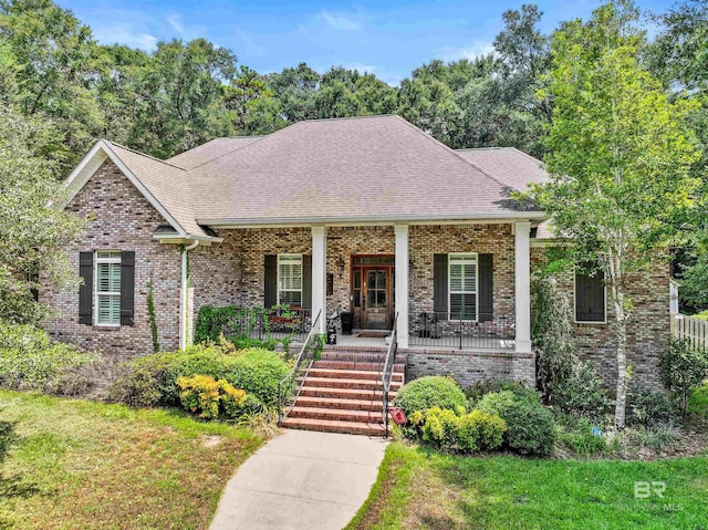 view of front of home featuring a porch and a front lawn