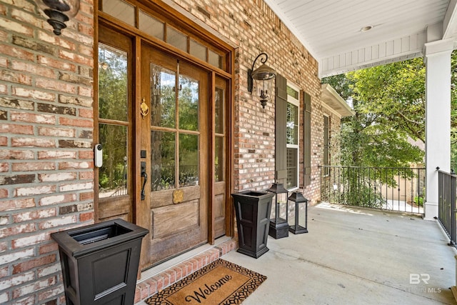 doorway to property with a porch