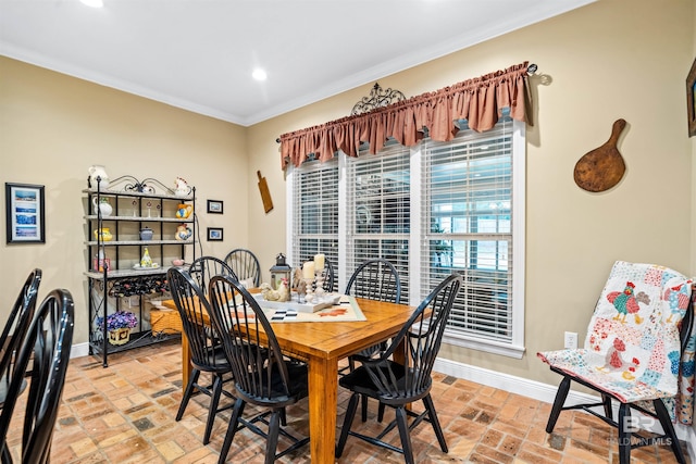 dining area featuring ornamental molding