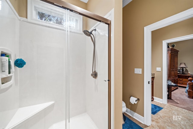 bathroom with vanity, an enclosed shower, and toilet