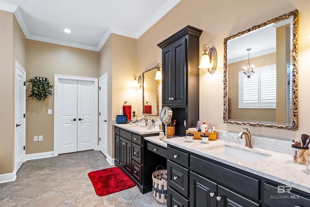 bathroom with vanity, crown molding, and a chandelier