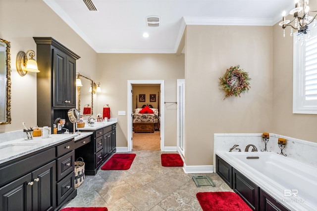 bathroom featuring crown molding, vanity, an inviting chandelier, and a bathtub