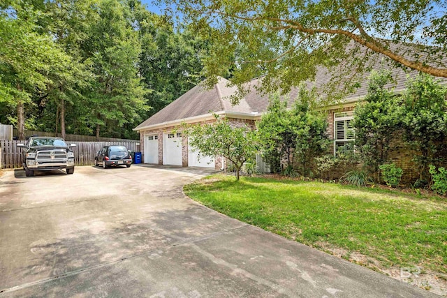 view of front facade with a garage and a front yard