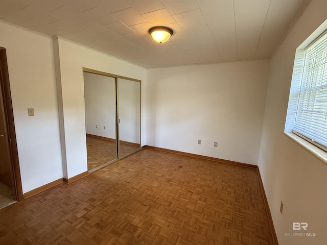 215 W Palm Ave, Foley, AL 36535 - unfurnished bedroom with a closet and baseboards