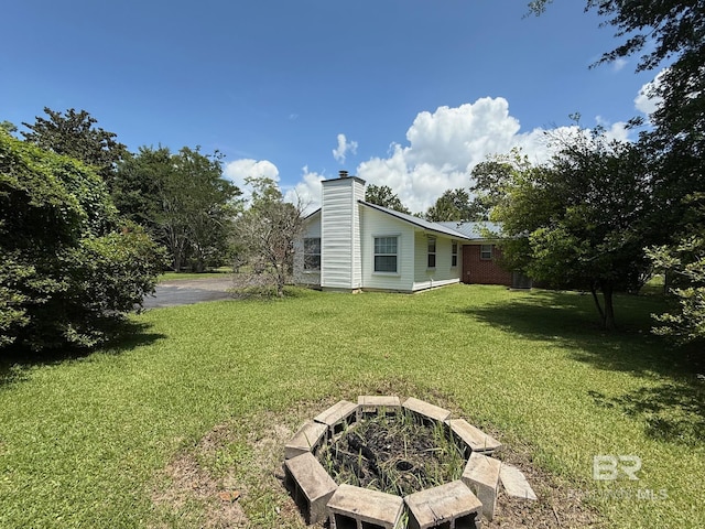 215 W Palm Ave, Foley, AL 36535 - view of grassy yard featuring a fire pit