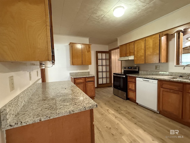 215 W Palm Ave, Foley, AL 36535 - kitchen with dishwasher, stainless steel electric range oven, brown cabinetry, under cabinet range hood, and light wood finished floors