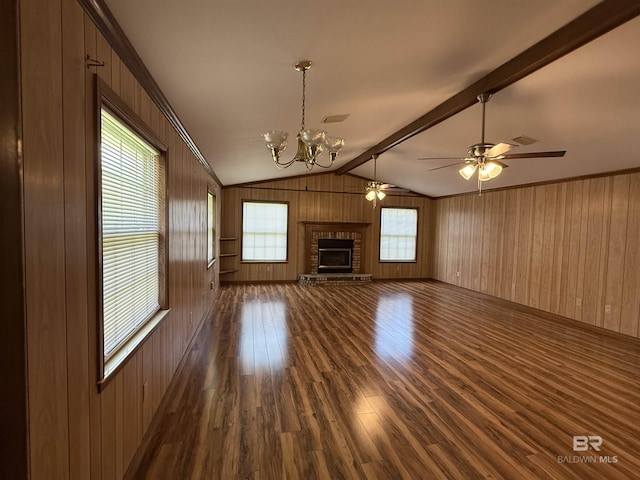 215 W Palm Ave, Foley, AL 36535 - unfurnished living room with dark wood finished floors, wooden walls, a chandelier, a fireplace, and a ceiling fan