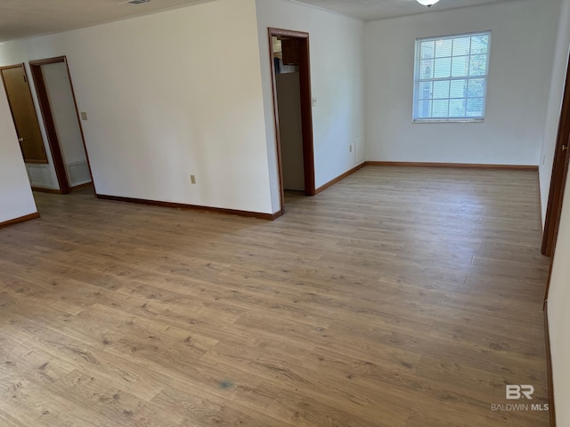 215 W Palm Ave, Foley, AL 36535 - spare room with baseboards and wood finished floors