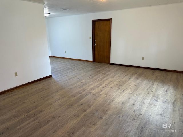 215 W Palm Ave, Foley, AL 36535 - unfurnished room featuring wood finished floors