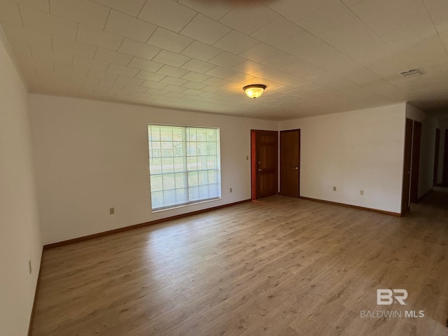 215 W Palm Ave, Foley, AL 36535 - unfurnished room with wood finished floors and baseboards