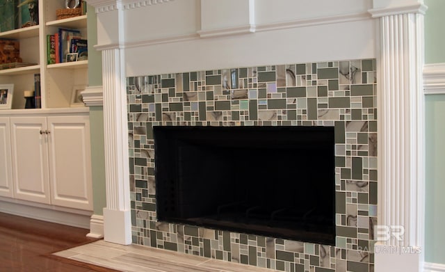 room details featuring a tile fireplace