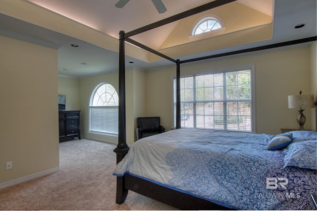 bedroom featuring light carpet, baseboards, lofted ceiling, and crown molding