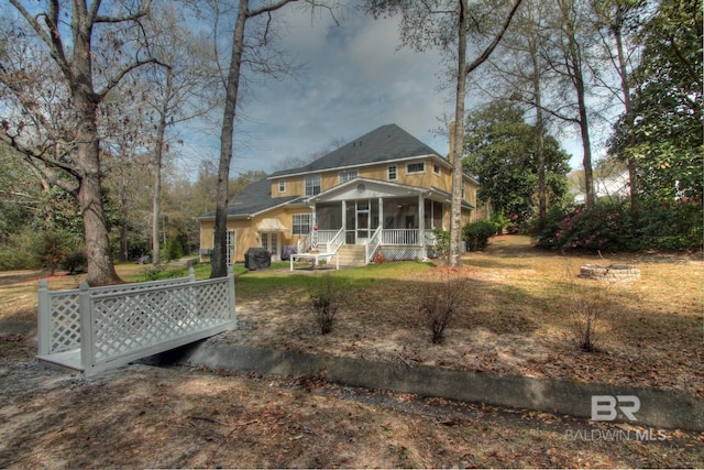 view of front of house featuring a sunroom