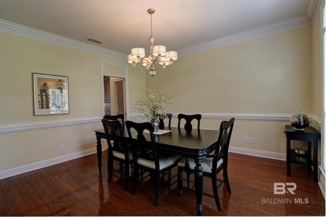 dining space featuring dark wood-style floors, baseboards, a notable chandelier, and ornamental molding