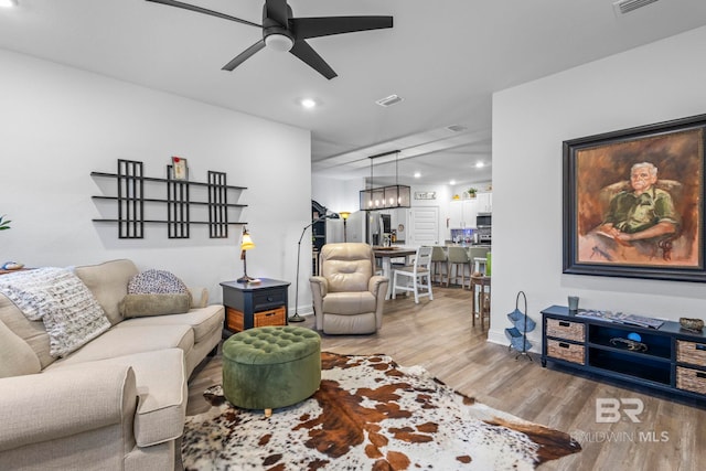 4142 Montague Dr, Gulf Shores, AL 36542 - living room featuring light wood-style floors, ceiling fan, and recessed lighting