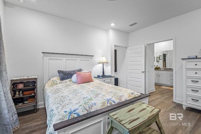 4142 Montague Dr, Gulf Shores, AL 36542 - bedroom featuring wood finished floors, recessed lighting, ensuite bathroom, and baseboards