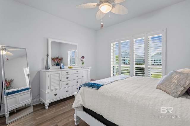 4142 Montague Dr, Gulf Shores, AL 36542 - bedroom with dark wood-style floors and a ceiling fan