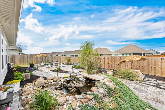 4142 Montague Dr, Gulf Shores, AL 36542 - view of patio / terrace with a fenced backyard and a residential view