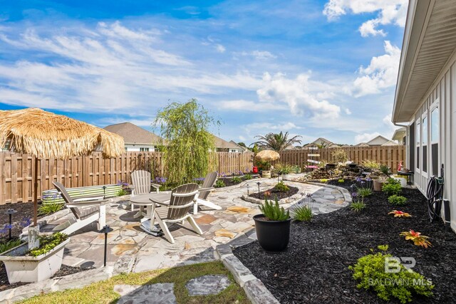 4142 Montague Dr, Gulf Shores, AL 36542 - fenced backyard with a patio area