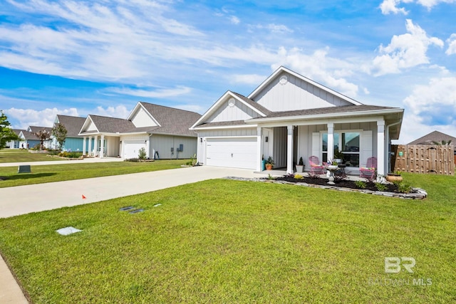 4142 Montague Dr, Gulf Shores, AL 36542 - view of front facade with board and batten siding, driveway, an attached garage, and a porch