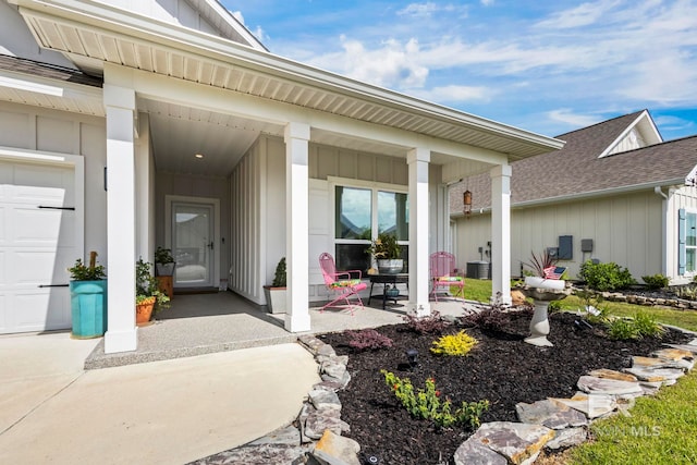 4142 Montague Dr, Gulf Shores, AL 36542 - entrance to property featuring board and batten siding, covered porch, and a shingled roof