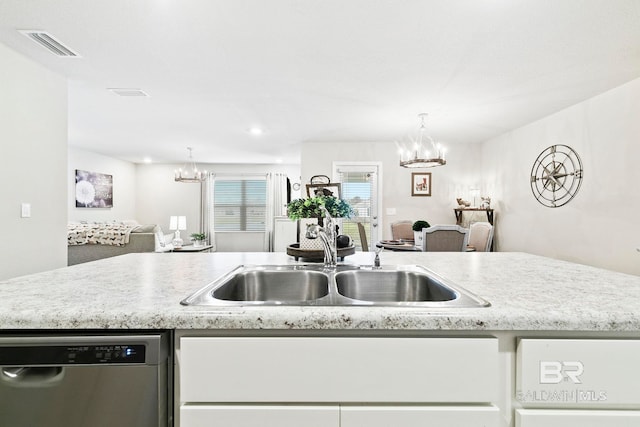 kitchen featuring dishwasher, white cabinetry, sink, and an inviting chandelier