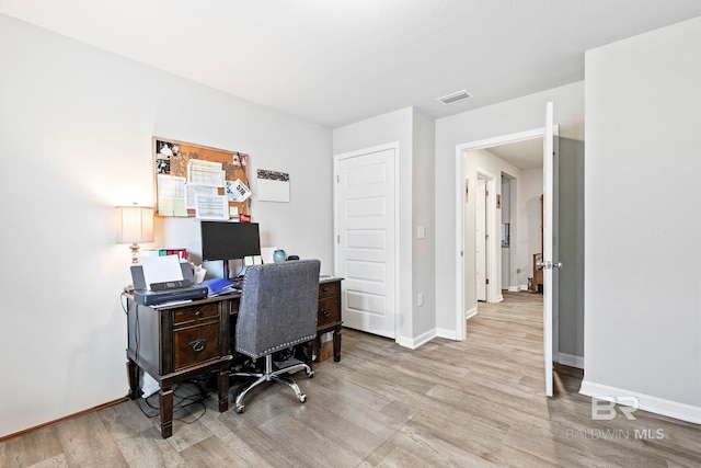 office space featuring light hardwood / wood-style floors