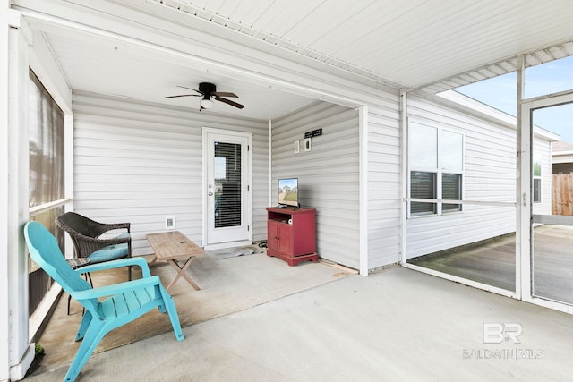 sunroom / solarium with ceiling fan