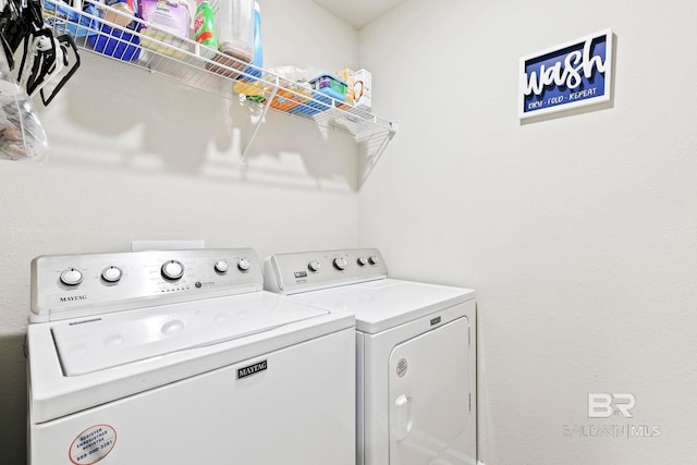 laundry area with separate washer and dryer