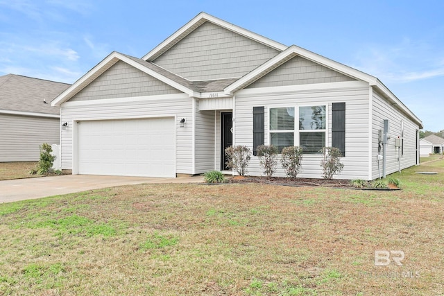 view of front of house with a front yard and a garage