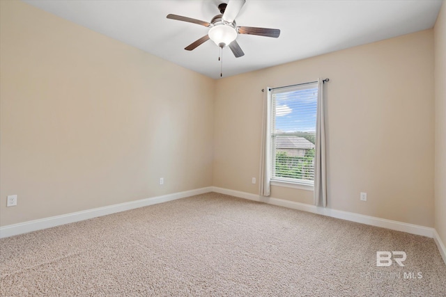 unfurnished room with carpet flooring and ceiling fan