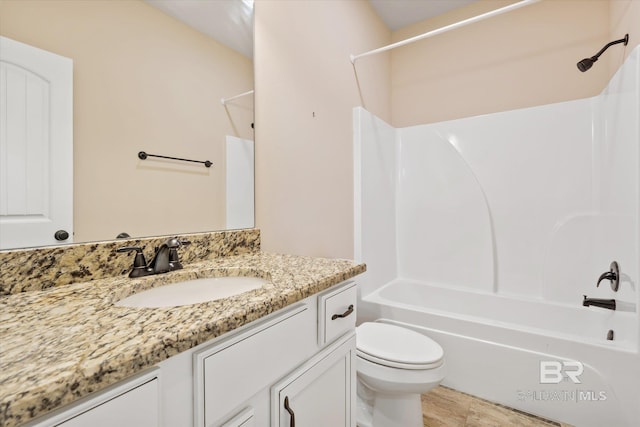 full bathroom featuring shower / bathing tub combination, vanity, and toilet