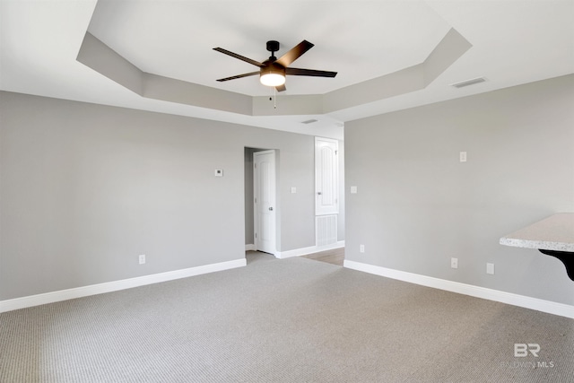 16529 Cold Mill Loop, Foley, AL 36535 - unfurnished room featuring a ceiling fan, light carpet, and a tray ceiling