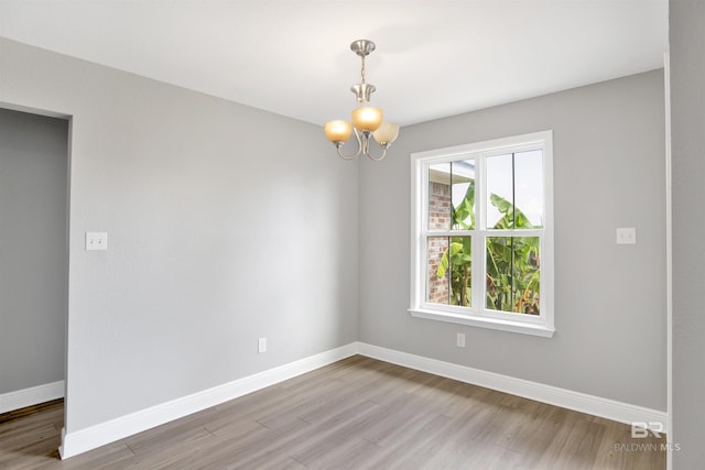 16529 Cold Mill Loop, Foley, AL 36535 - unfurnished room featuring wood finished floors and a chandelier