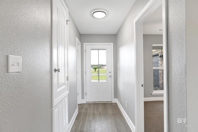 16529 Cold Mill Loop, Foley, AL 36535 - doorway to outside featuring wood finished floors and a textured wall
