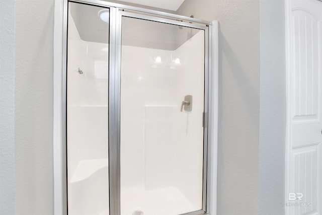 16529 Cold Mill Loop, Foley, AL 36535 - full bathroom with a shower stall and a textured wall