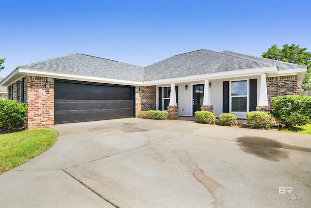 16529 Cold Mill Loop, Foley, AL 36535 - view of front of house with brick siding, an attached garage, driveway, and a shingled roof