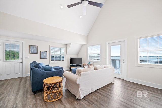 living room featuring ceiling fan, dark hardwood / wood-style flooring, and high vaulted ceiling