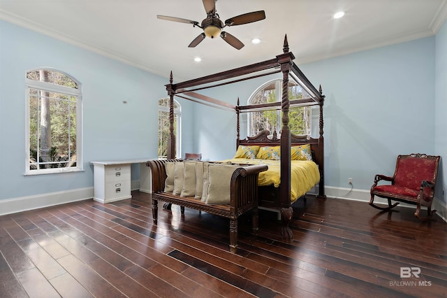 bedroom featuring ceiling fan, dark hardwood / wood-style flooring, and crown molding