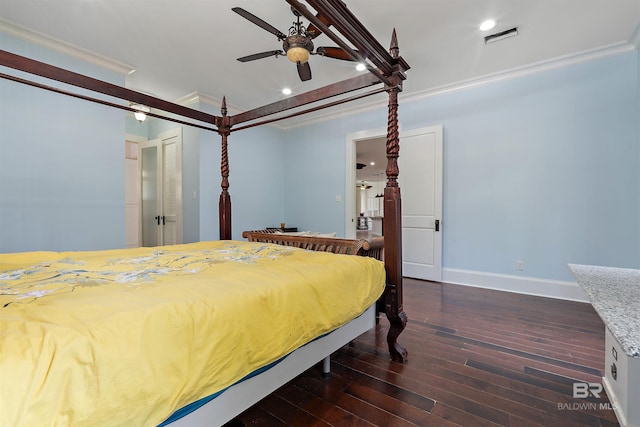 bedroom featuring ceiling fan, ornamental molding, dark wood-type flooring, and a closet