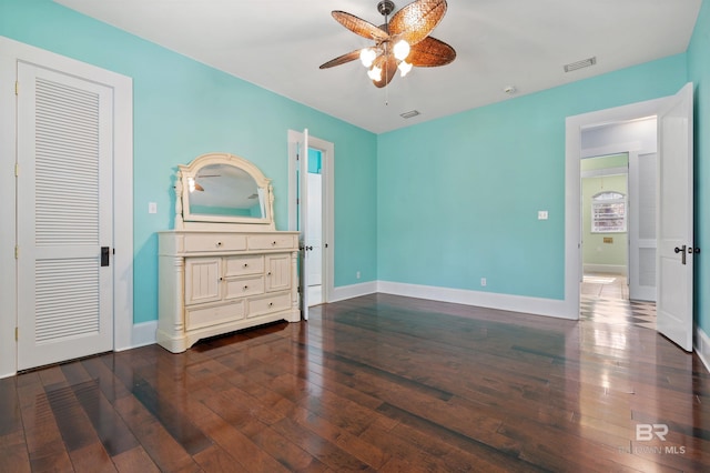 bedroom featuring ceiling fan and dark hardwood / wood-style flooring