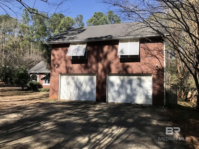 view of side of property featuring a garage