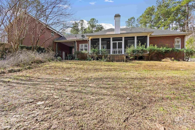 rear view of house with a sunroom