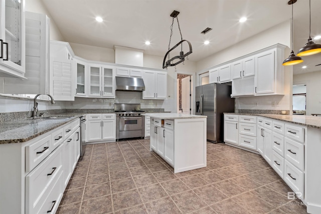 kitchen with white cabinets, stainless steel appliances, and decorative light fixtures